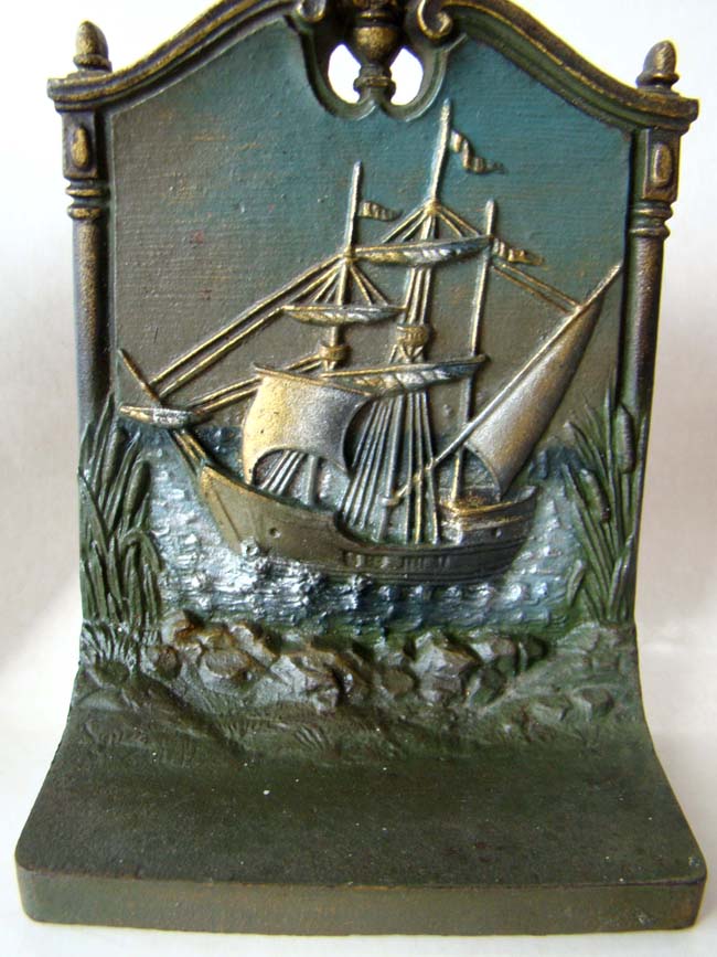 A pair of cast iron bookends circa 1930 by Bradley & Hubbard depicting the Mayflower and the Pilgrims landing at Plymouth. — image 3